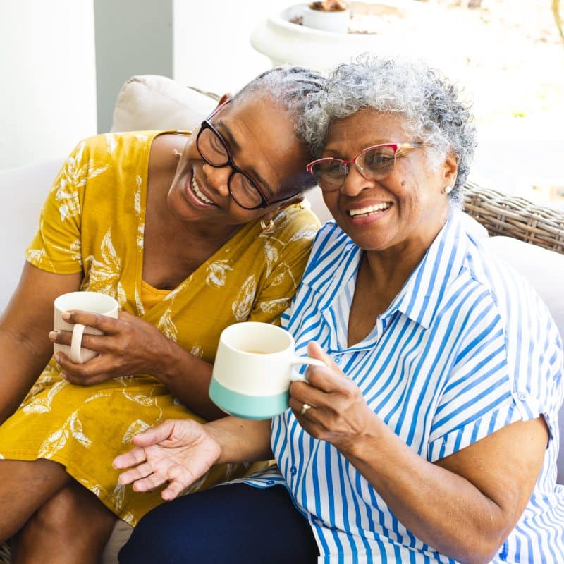 Roselani Place | Senior women smiling while having coffee