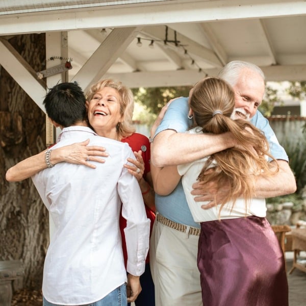 Roselani Place | Seniors hugging family
